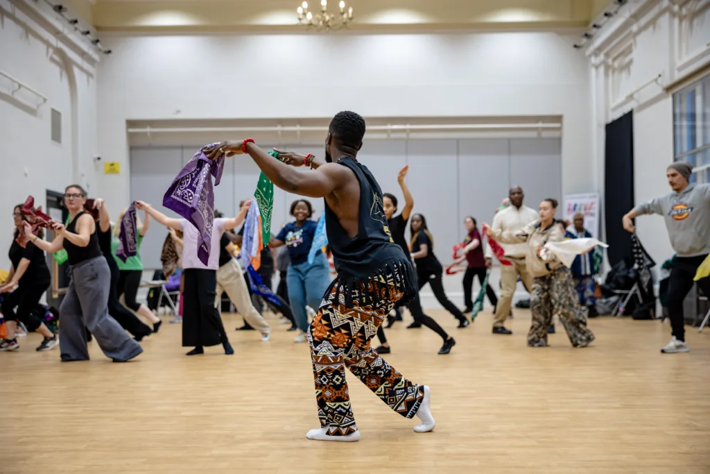 Jojo Keke teaching afro groves dance class at Bradford Arts Centre